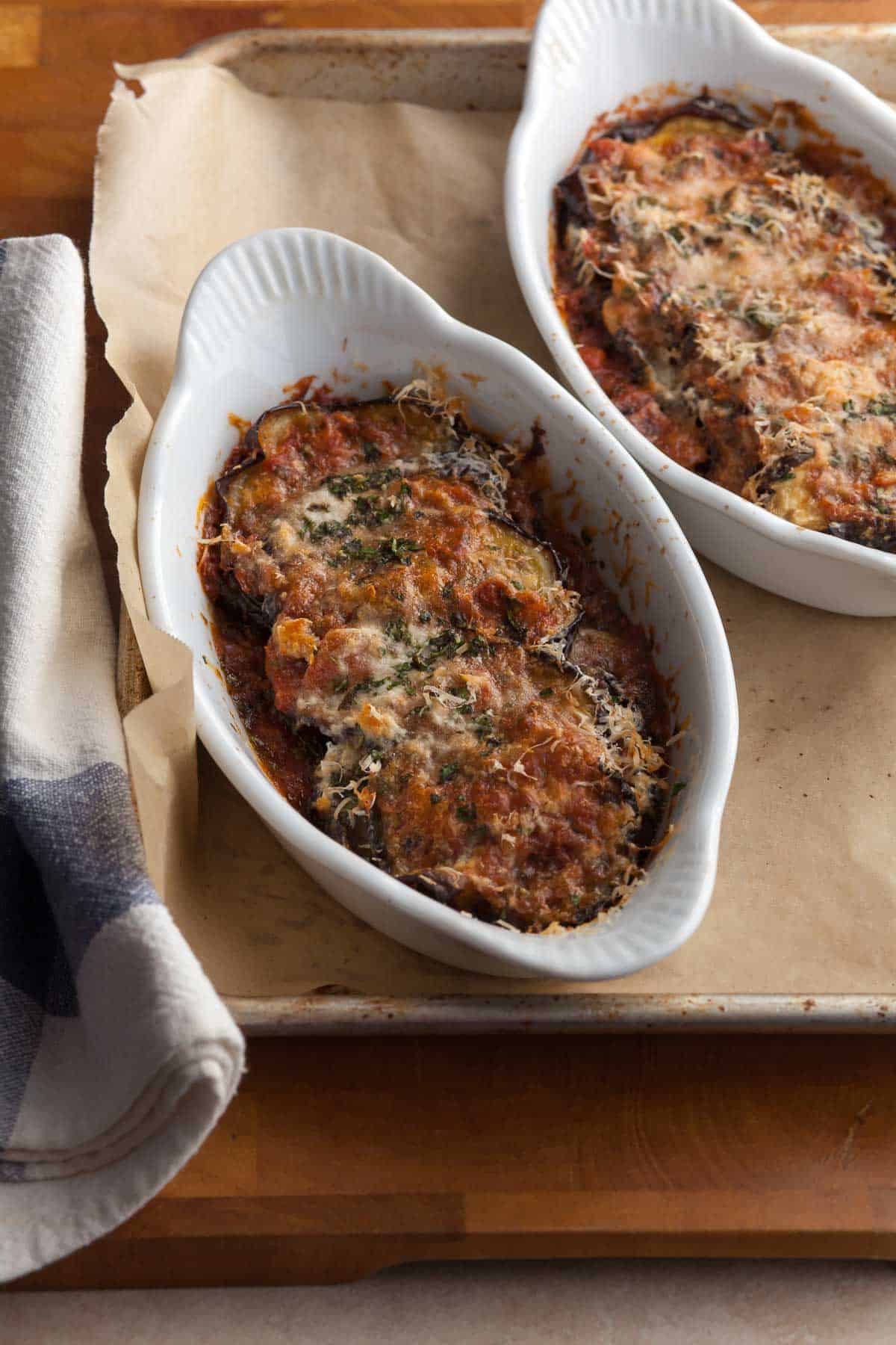 Eggplant baked in gratin dishes with tomato sauce and cheese
