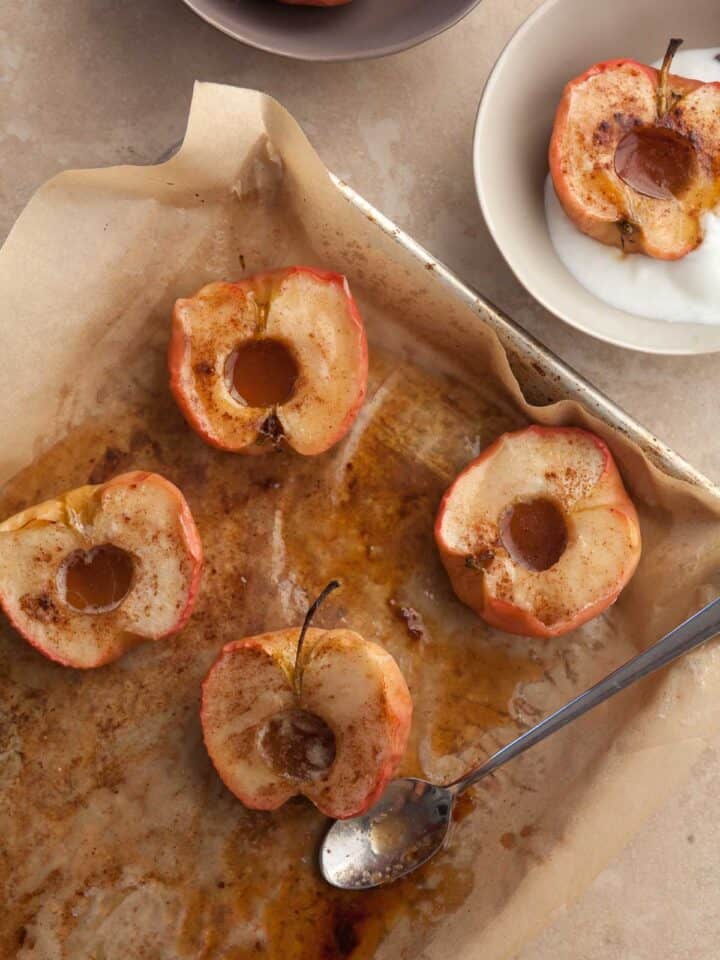 easy roasted apples with cinnamon, butter and maple syrup on sheet pan