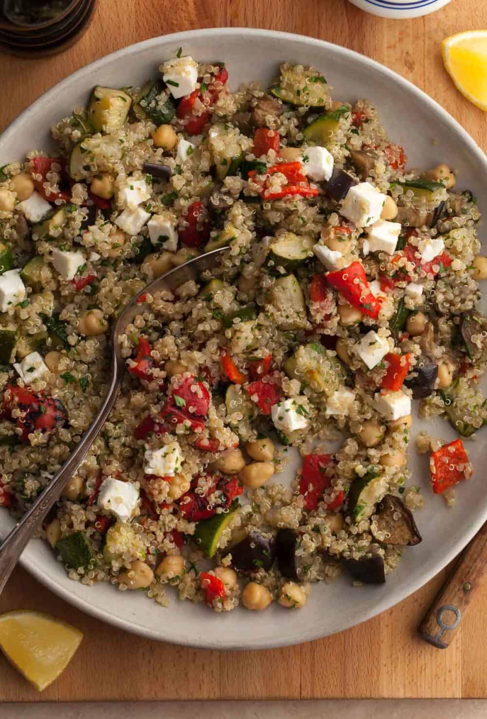 roasted vegetable quinoa salad with roasted zucchini, eggplant and red peppers on plate