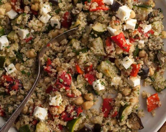 roasted vegetable quinoa salad with roasted zucchini, eggplant and red peppers on plate