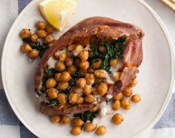 Chickpea Stuffed Sweet Potatoes with Tahini Sauce and Kale on Plate